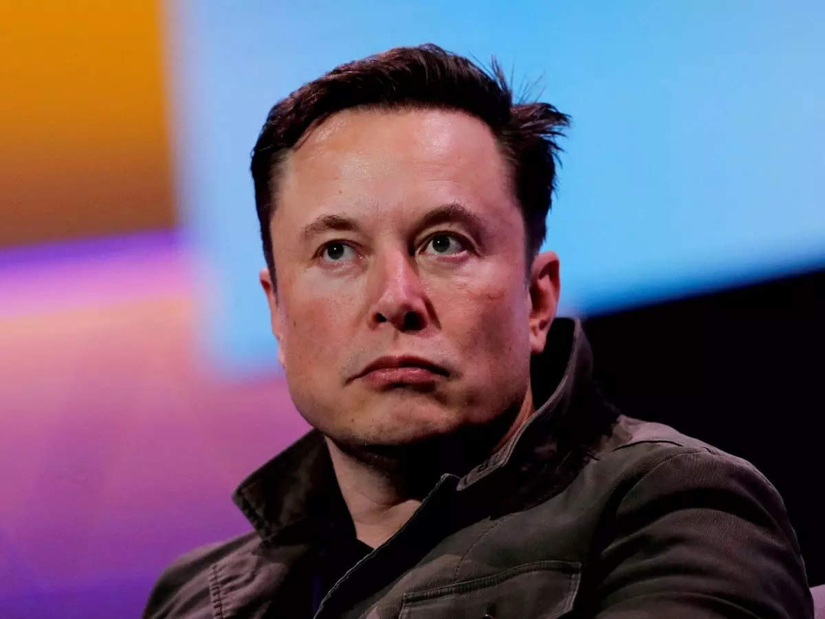 Elon musk holding off blue tick