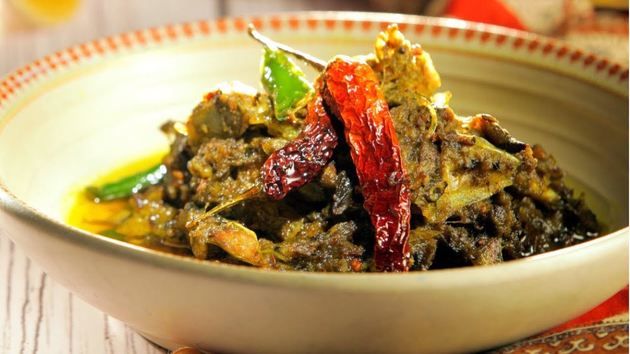Cook a lot of greens with hilsa fish head like this