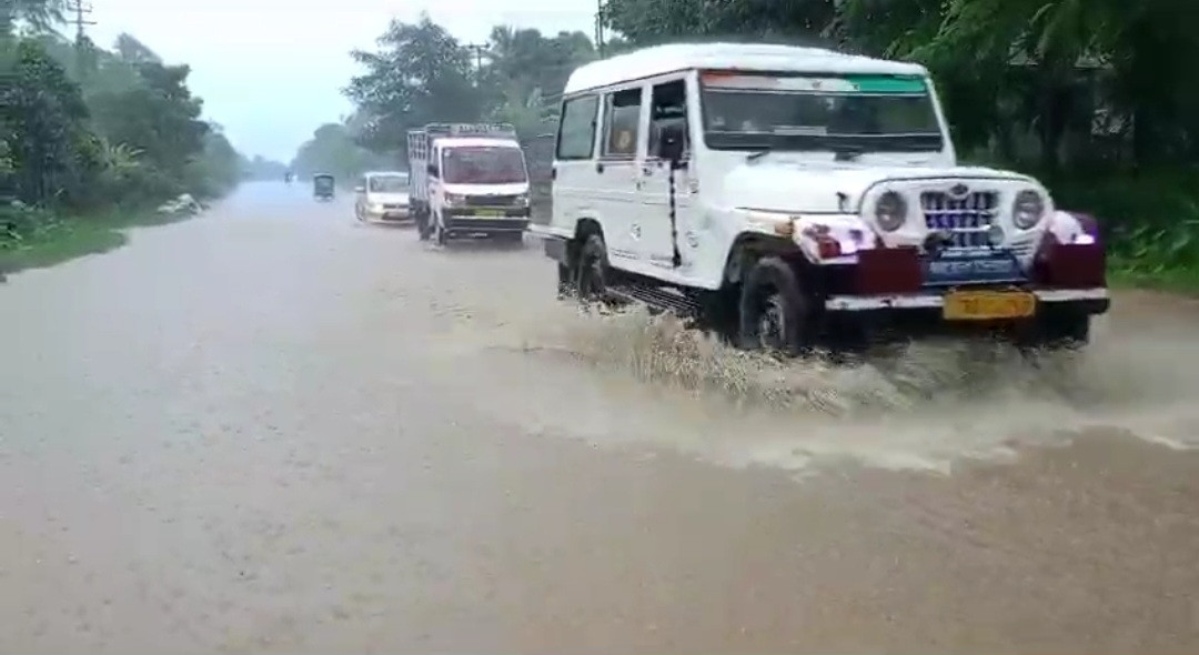 There is almost knee-deep water on the National Highway in Charilam