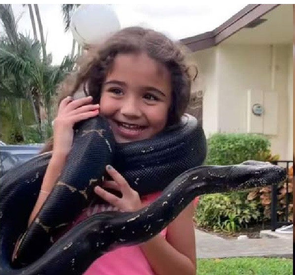 A baby girl with a snake