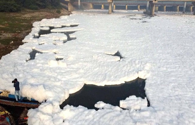 The waters of the Yamuna are still polluted, with poisonous foam floating in Kalindi Kunj