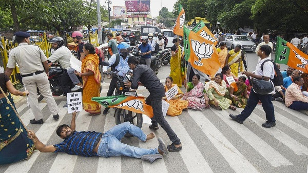 BJP supporters block a road and stop vehicles during ‘Bihar bandh’