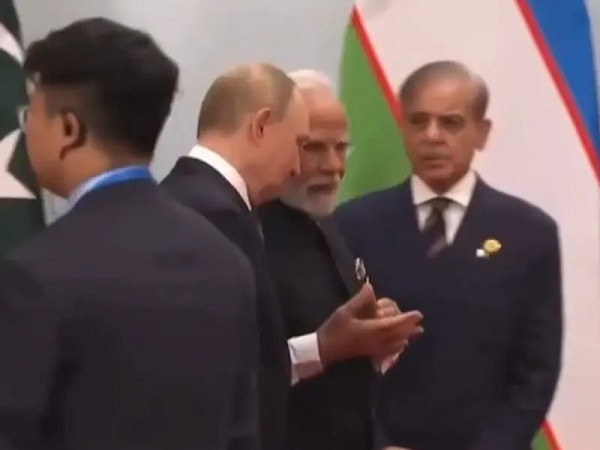 PM Modi and Putin in conversation, Shehbaz Sharif watching on