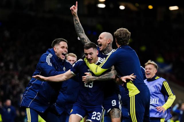 Scotland celebrate after securing a spot in the World Cup