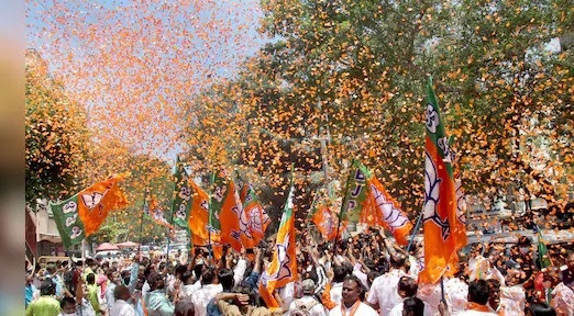 BJP workers celebrate the party's landslide victory at the Patna headquarters
