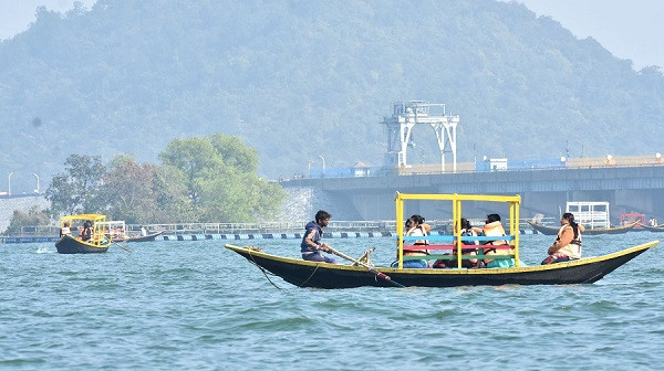 Tourists enjoy a boat ride in Maithon Lake in Dhanbad