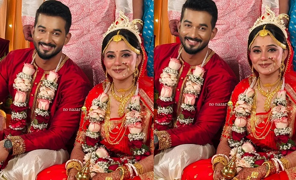 The newlyweds in their wedding attire