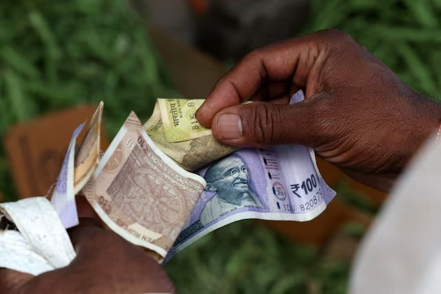 Indian rupee hits record low as prolonged