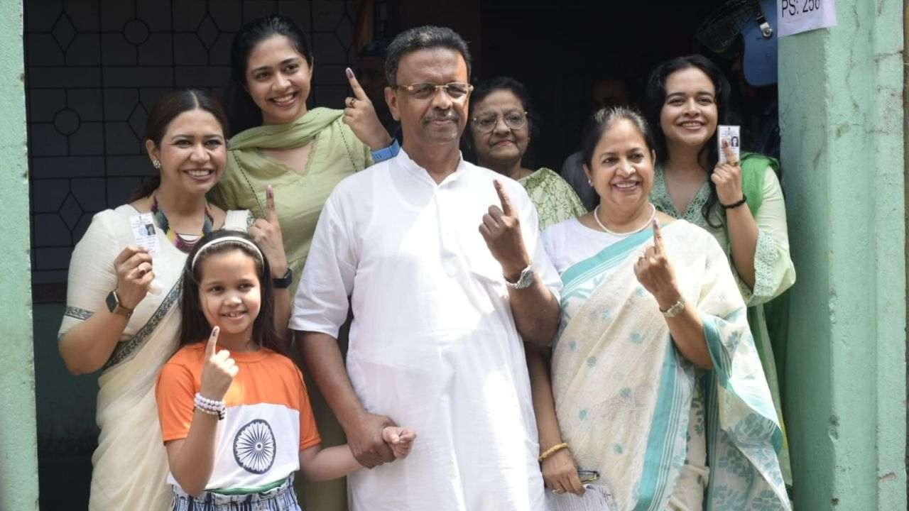 Firhad Hakim casts his vote with his family.