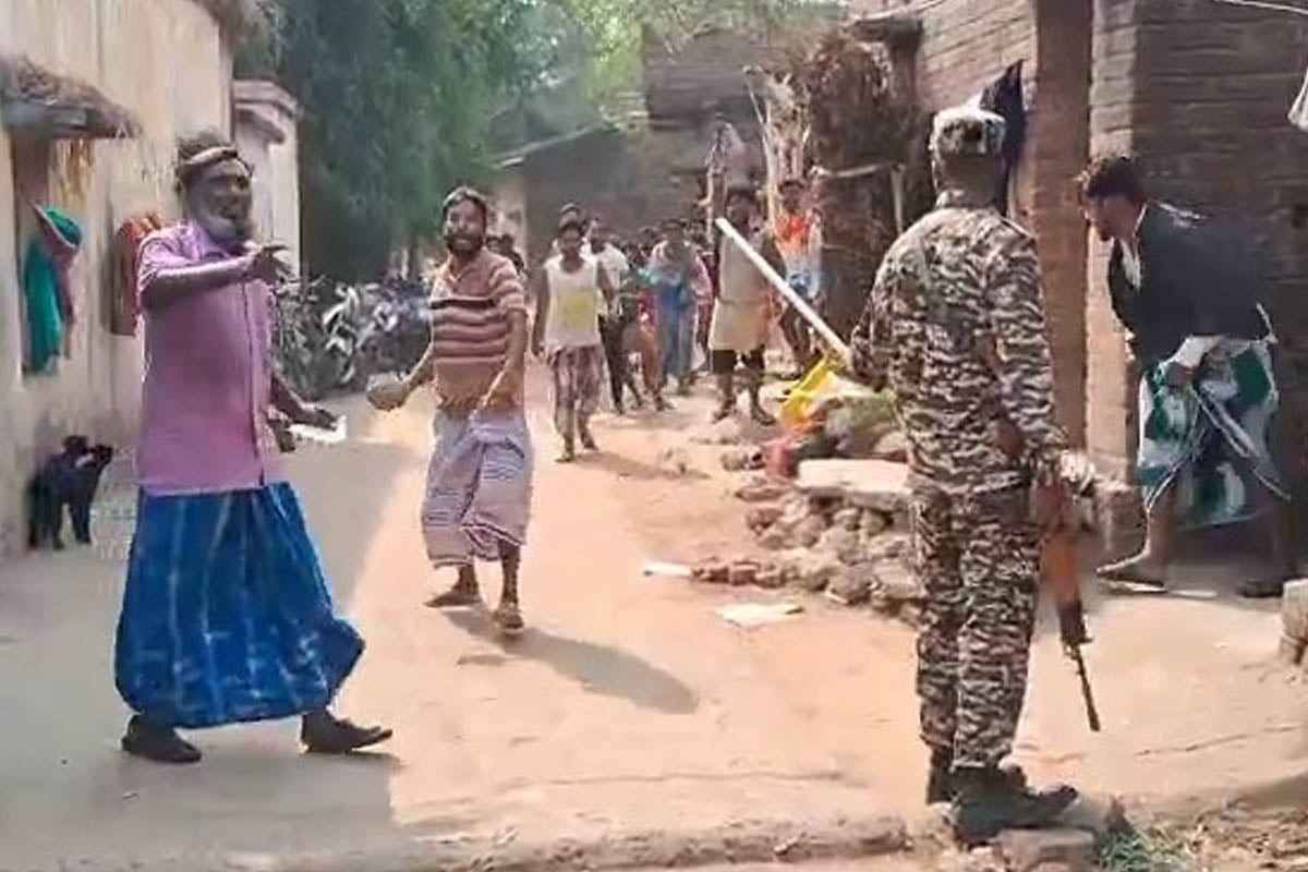 Agitated crowd rains bricks on forces in Khayrashol.