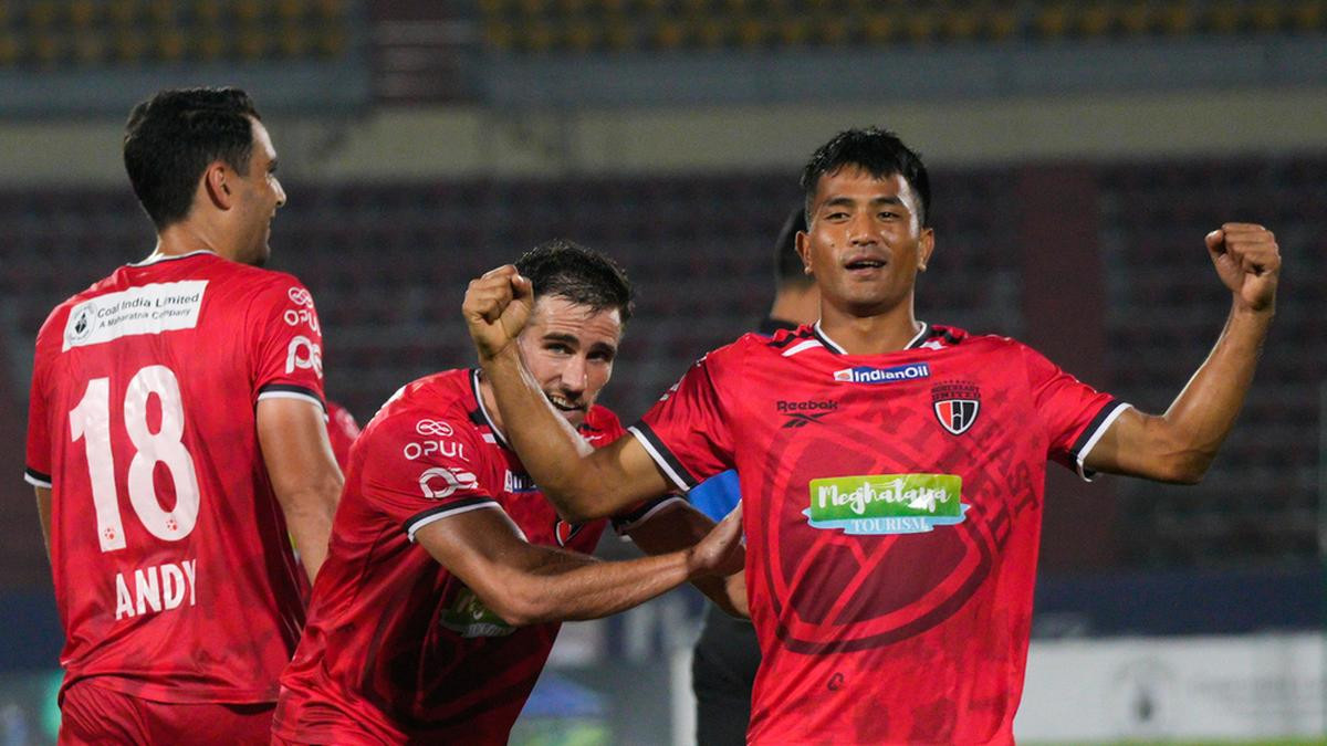 NEUFC players celebrate after scoring a goal against Chennaiyin FC