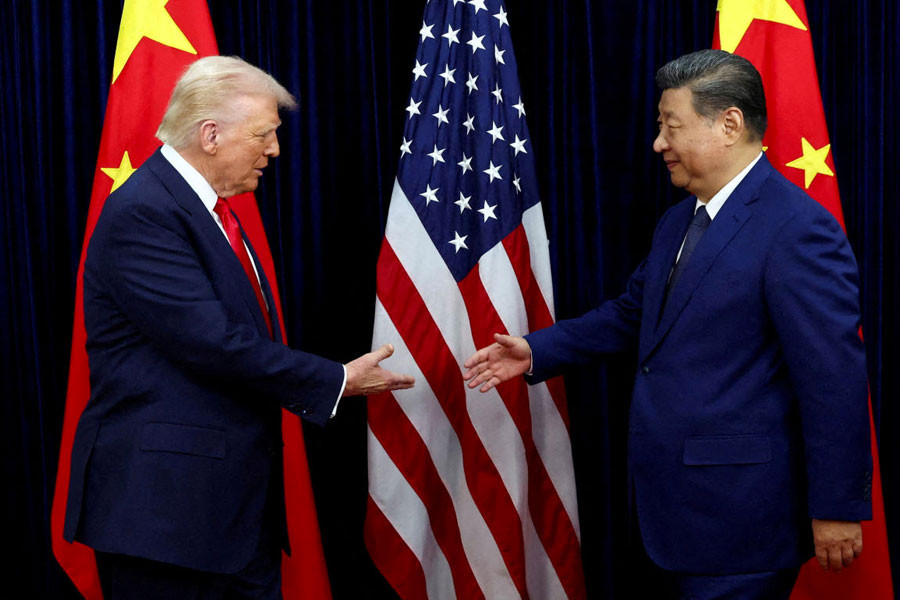 U.S. President Donald Trump shakes hands with Chinese President Xi Jinping