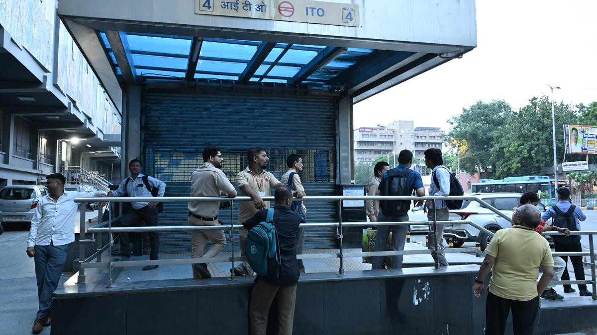 People outside the ITO Metro station which remains closed due to security reasons