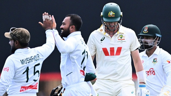 Australia captain Pat Cummins departs after being dismissed by Mehidy Hasan of Bangladesh