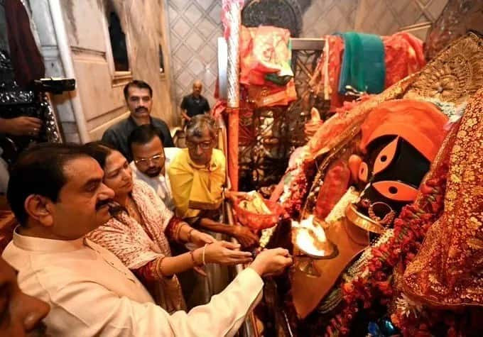Gautam Adani with his wife at Kalighat