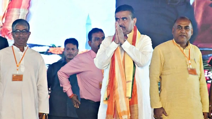 Chief Minister and Suvendu Adhikari on the dais at the Malda meeting