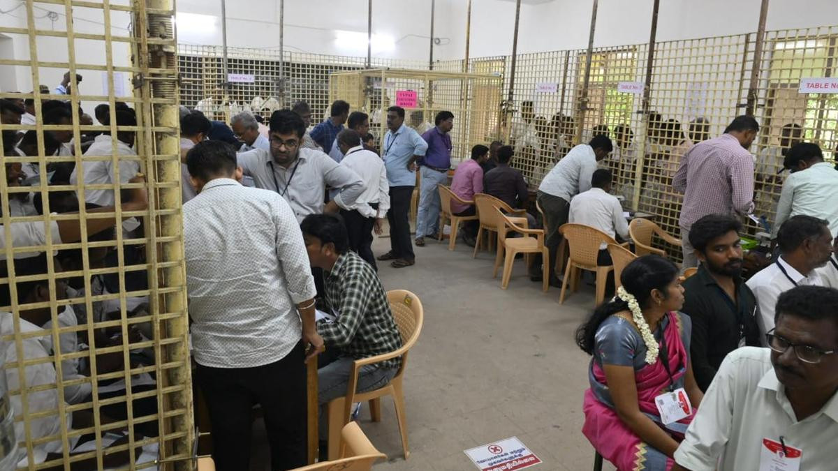 Officials count the votes for the Thattanchavady bypoll on Friday